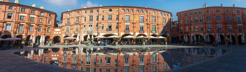 Fototapeta premium Nationale square and its water mirror in autumn in Montauban, in Tarn et Garonne, in Occitanie, France