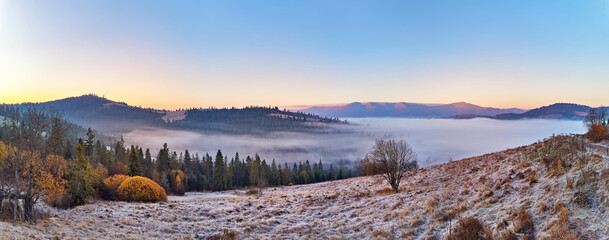 Mountain autumn misty Sunrise panorama. Majestic Morning fog, November Valley Aerial scene. Ice, frost on grass. Fall sunny Landscape, forest hills. Beautiful tonal perspective - 545258765