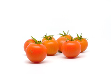 Fresh tomatoes isolated on white background...Cherry tomatoes on white background...Round red trellis tomatoes, also called vine tomato.
