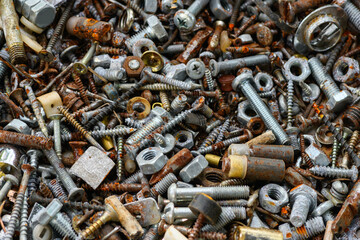 Lots of rusty bolts, self-tapping screws, nails close-up