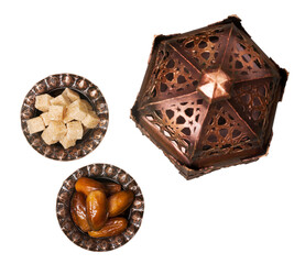 Ornamental dark Moroccan, Arabic lantern and plate with sugar and dates