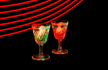 Two glasses with vodka and ice cubes