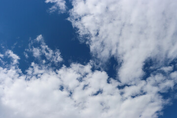 Blue sky and white clouds background.