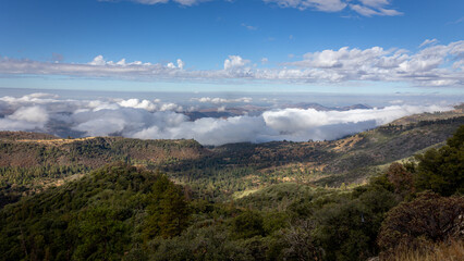Beautiful vistas of the valleys and forests of Kings Canyon and Sequoia National Park, with low clouds and blue skies