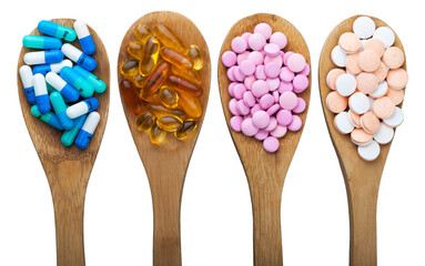 Healthy supplements on metall teaspoons