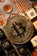 Fototapeta na wymiar The bitcoin gold coin lies on an electronic circuit