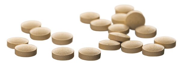 Many round medical pill scattered