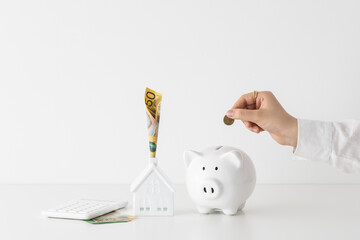 Australian fifty 50 dollars note currency woman holding model house home