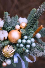 Christmas decoration with dry orange, balls and candle. New year decoration for cozy home