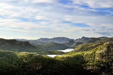 Fototapeta na wymiar Rocky landscape with valley and small lakes - Preikestolen, Norway