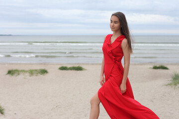 Fototapeta na wymiar young asian teen in red long dress