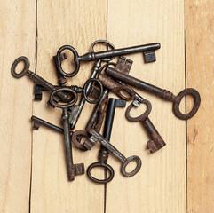 old keys on a background of wooden boards