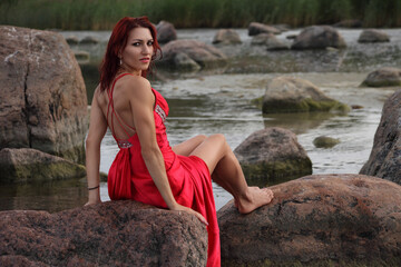 young woman in dress on the beach