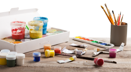 Artist's workshop. Canvas, paint, brushes, palette knife lying on the table.