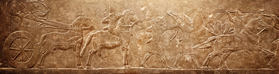 Assyrian relief on the wall. Ancient stone carving from the Middle East. Historical and culturical...