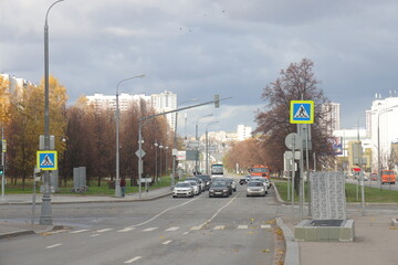 Traffic on Varshavskoe highway. Dark stormy clouds. Contrasting sky. Dirty cars on the road. Moscow, October 2022.