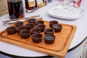 The traditional Ginja de Obidos, traditional sour cherry liquor, served in small cups made of chocolate. Obidos, Portugal