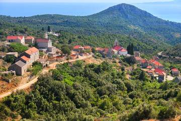 Fototapeta na wymiar Bird view of Velo Grablje. Historic village on Hvar island in Croatia famous for lavender, red vine and olive oil production. Aerial view from an old mountain road.