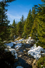 Chamrousse France 06 11 2022 winter hike around Lac Achard, pretty mountain lake located at 1917...