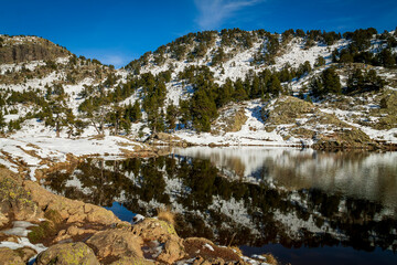 Chamrousse France 06 11 2022 winter hike around Lac Achard, pretty mountain lake located at 1917...