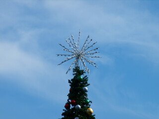 christmas tree on blue sky