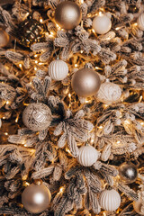 Obraz premium Vertical image of cozy flat apartment room green Christmas Tree gifts presents garlands, candles decorated toys balls interior New Year beautiful living room in the evening, lights glowing bokeh 