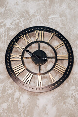 Antique retro wooden clock hanging on the wall in flat or house
