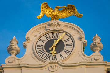 Clock tower with golden eagle over hofburg, Vienna at sunrise, Austria