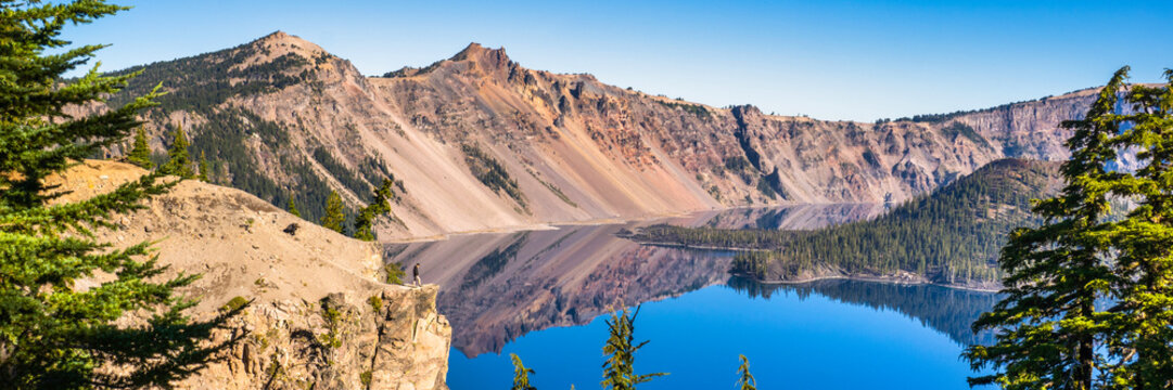 Panoramic view of Crater Lake on a calm and clear summer morning.