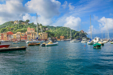 Portofino with houses, luxury boats and yacht, bay harbor. Liguria, Italy