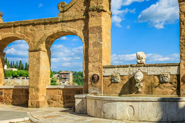 Pitigliano fountain, cityscape square corner, Tuscany, Italy