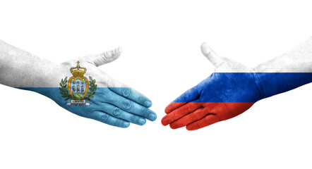 Handshake between Russia and San Marino flags painted on hands, isolated transparent image.