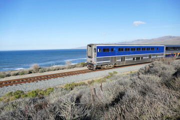 commuter train traveling north along the Pacific coastline