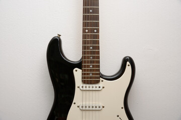 Obraz na płótnie Canvas black and white electric guitar close up