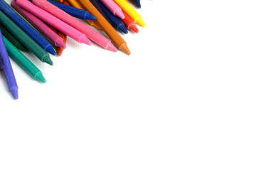 Crayons lined up isolated on white background.