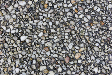 little pebbles embedded in concrete – a surface texture