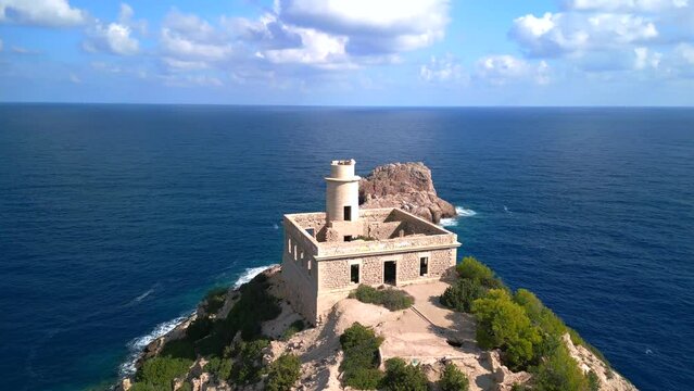 view sky clouds lighthouse ruin ibiza spain. Gorgeous aerial view flight