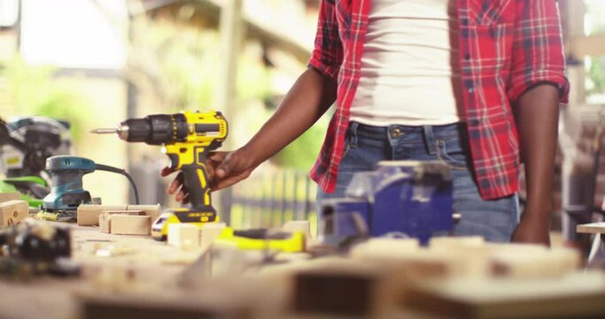 Portrait of beautiful young woman carpenter standing in workroom