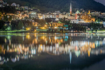 St Moritz cityscape and lake reflection at night, Engadine, Swiss alps