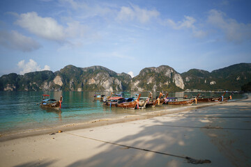 long tail boats on the beach in thailand