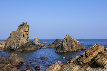 Beautiful rock and bolders on the seashore along the coastline 
