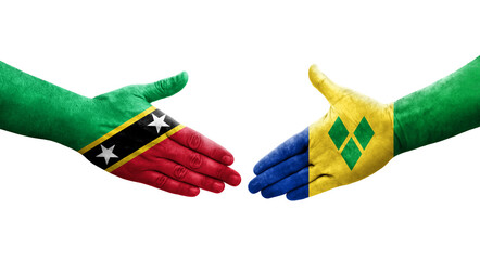 Handshake between Saint Vincent Grenadines and Saint Kitts and Nevis flags painted on hands, isolated transparent image.