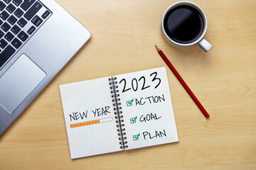 2023 Happy New Year Resolution Goal List and Plans Setting - Business office desk with notebook...