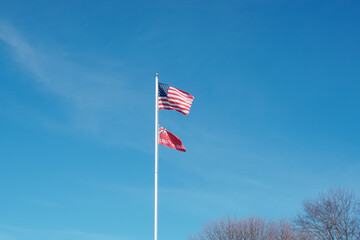 Flying national flag and city flag of Taunton in the sky Taunton MA USA