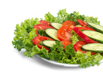 Close-up photo of fresh salad with vegetables in white plate