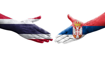 Handshake between Serbia and Thailand flags painted on hands, isolated transparent image.
