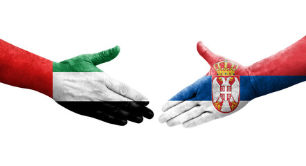 Handshake between Serbia and UAE flags painted on hands, isolated transparent image.