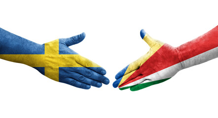 Handshake between Seychelles and Sweden flags painted on hands, isolated transparent image.