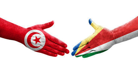 Handshake between Seychelles and Tunisia flags painted on hands, isolated transparent image.