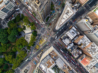Aerial top down view of New York downtown street intersection and city park. Manhattan buildings with yellow cabs and cars